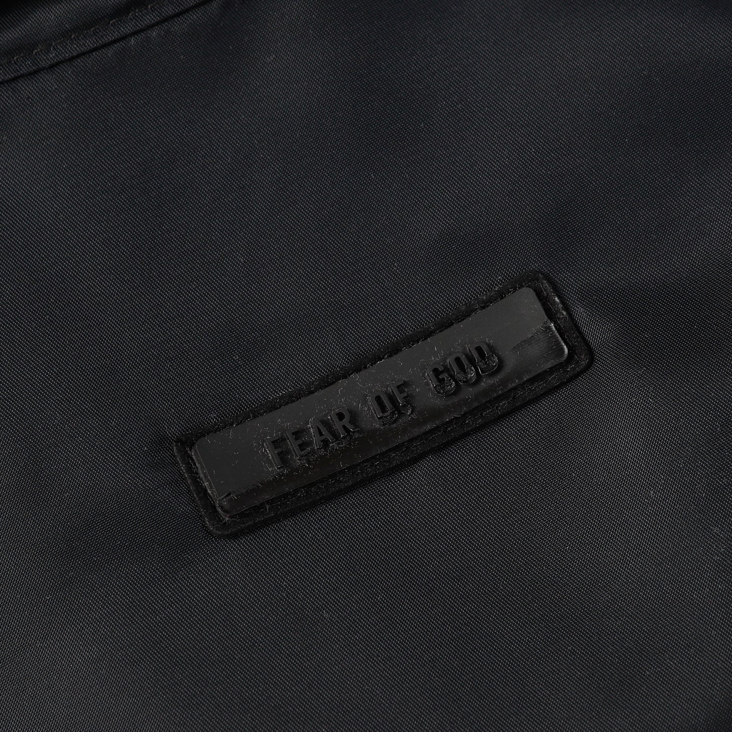 Chaqueta FEAR OF GOD ESSENTIALS Logo